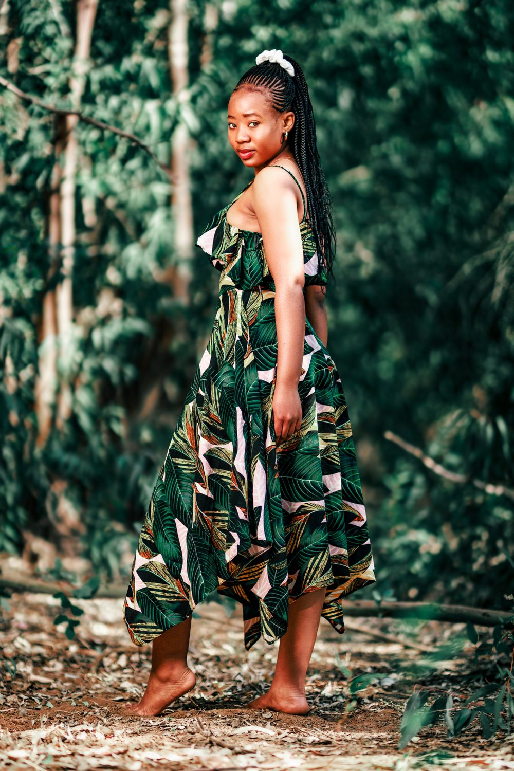 A Young Woman Wearing a Dress Posing in a Forest · Free Stock Photo