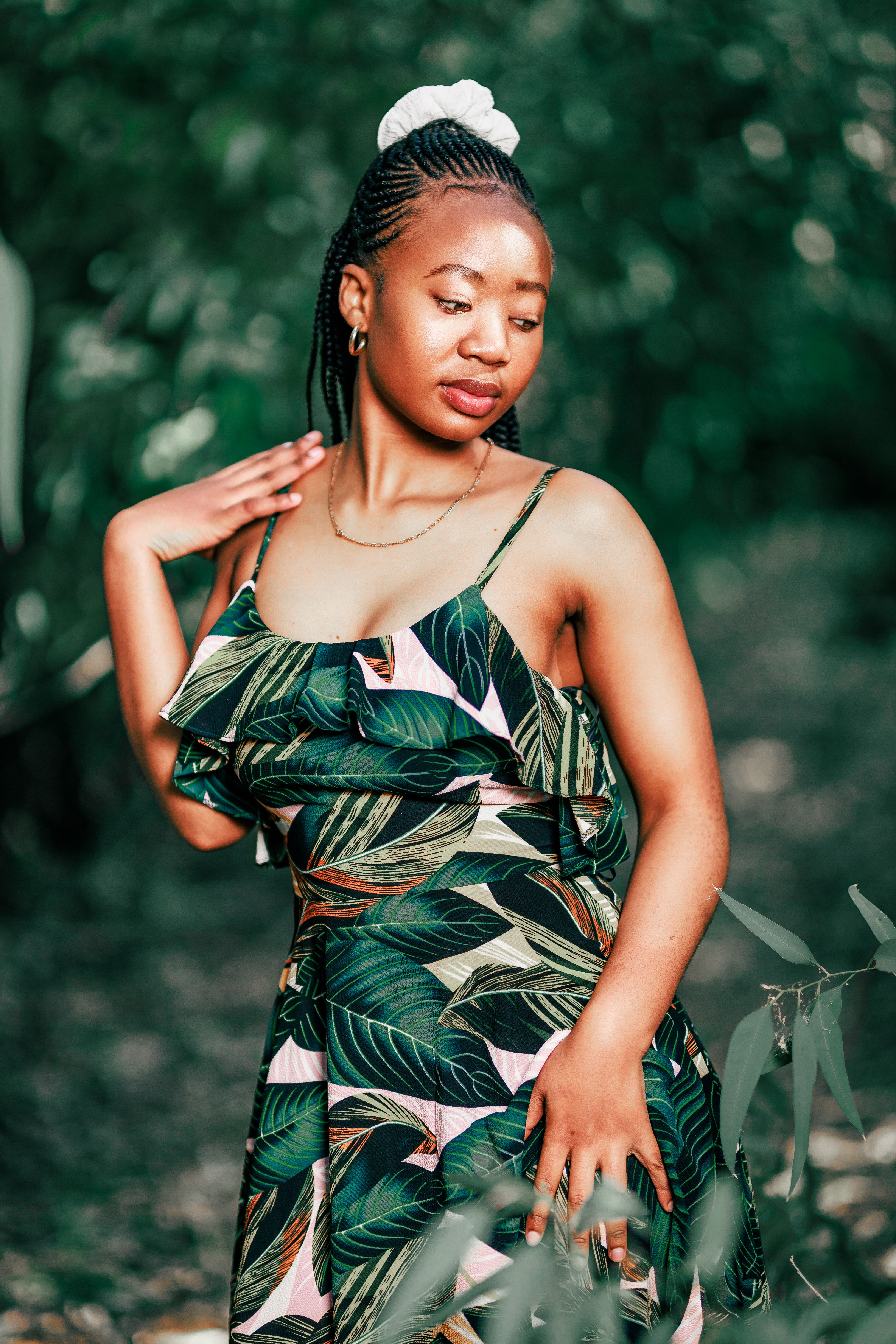 A Young Woman Wearing a Dress Posing in a Forest · Free Stock Photo