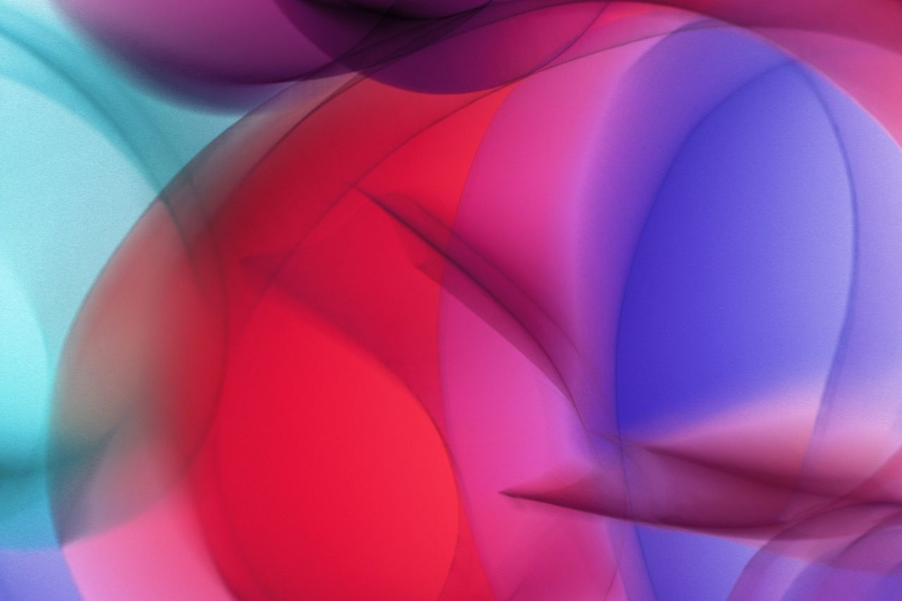 a vibrant and colorful abstract image with swirling shapes in a modern