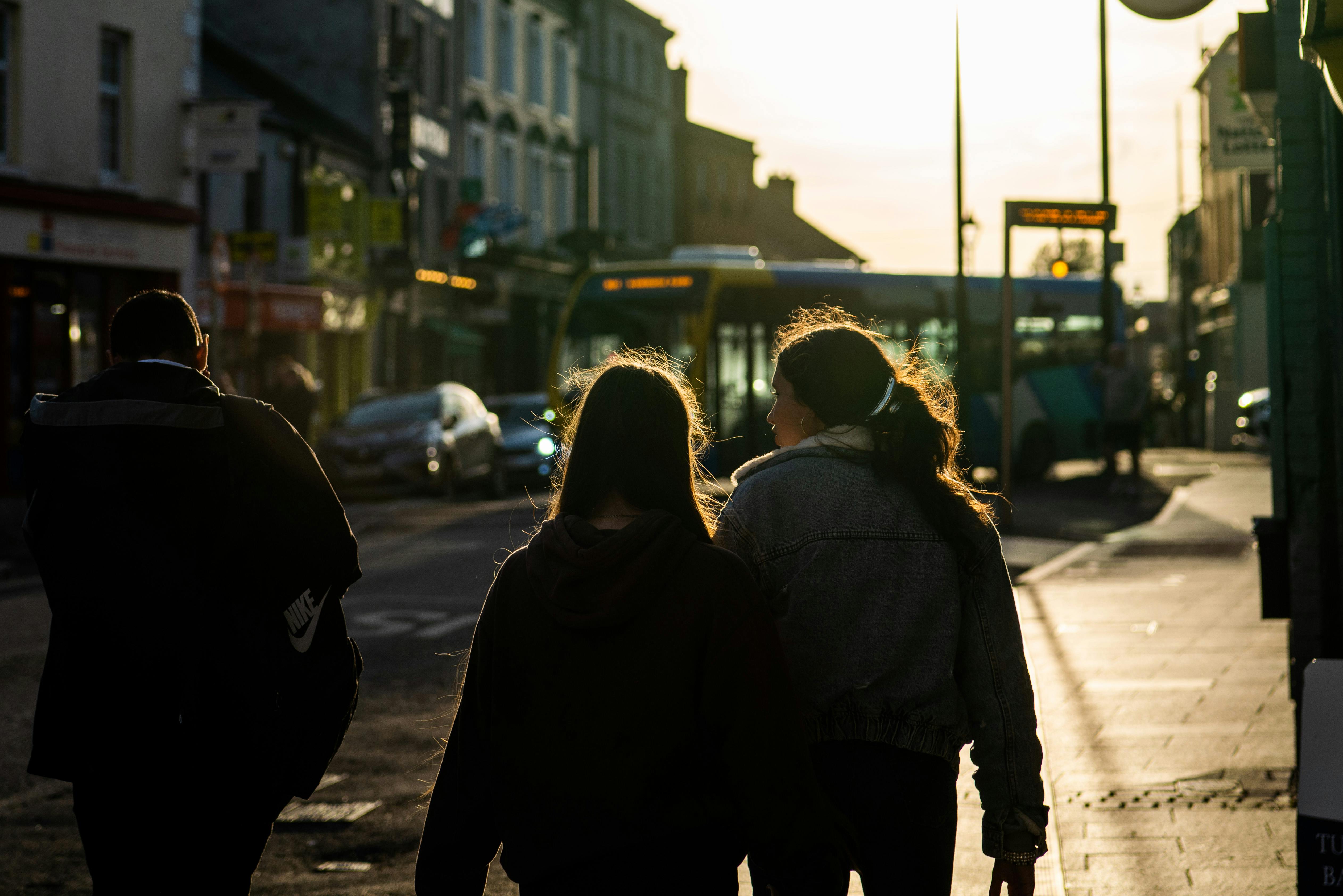 Women planning Ireland trip using travel map and guides