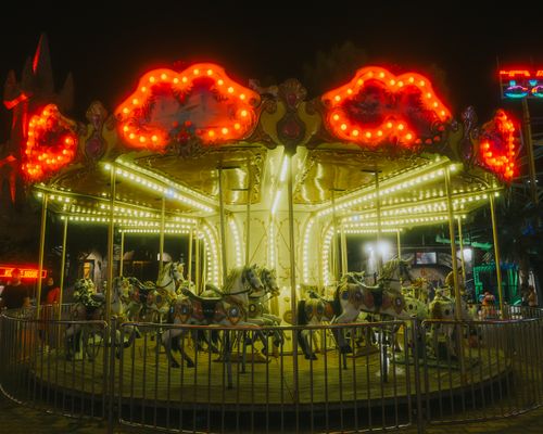 Free Brightly lit carousel at night in Antalya, Türkiye, capturing festival fun. Stock Photo