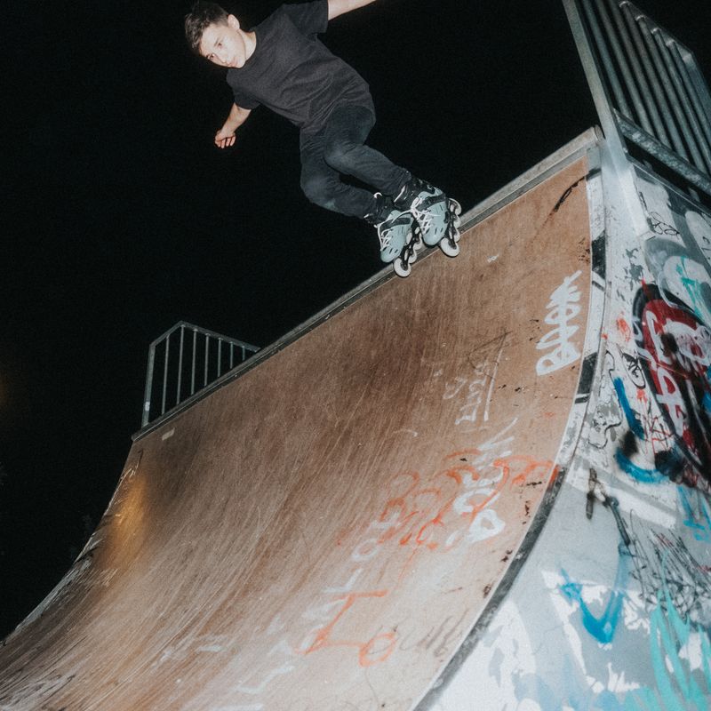 Skater trick at a night skatepark