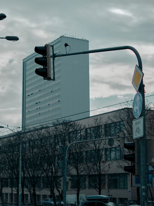 Free Cityscape of Bratislava with streetlights and modern architecture under cloudy skies. Stock Photo