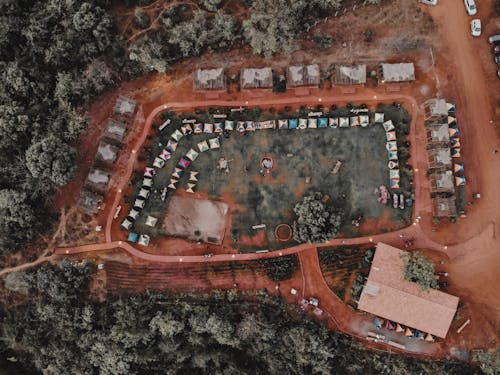 Aerial Photography of Brown Field Surrounded by Trees