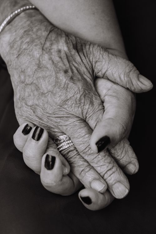 Free Close-up of elderly hands holding each other, showing love and connection. Stock Photo