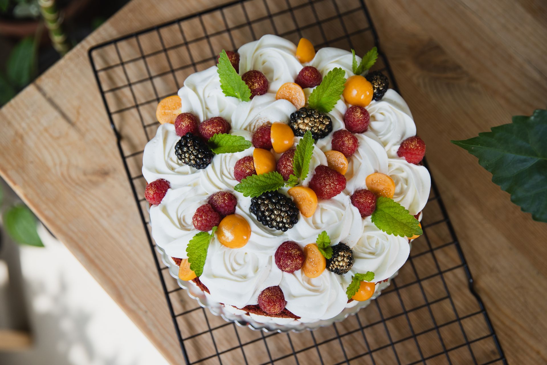 Naked chocolate cake with vanilla cream and summer fruits