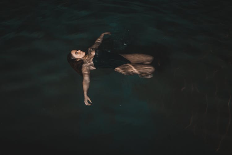 Woman Floating On Water