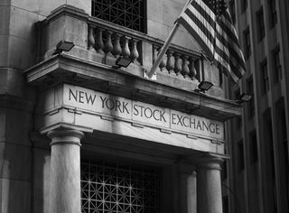 New York Stock Exchange facade and American flag