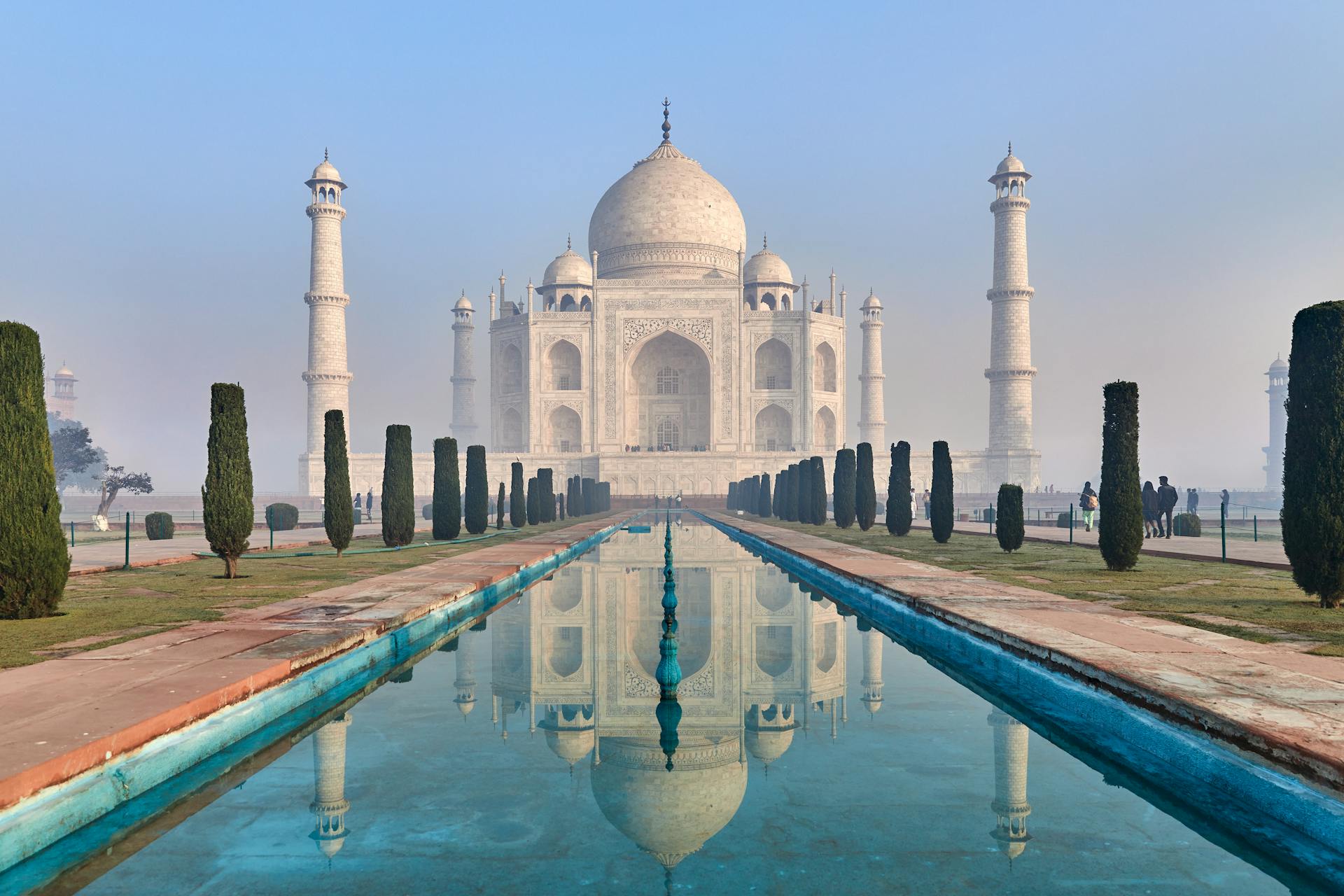 Captivating view of the iconic Taj Mahal reflecting in the water, showcasing its architectural beauty.