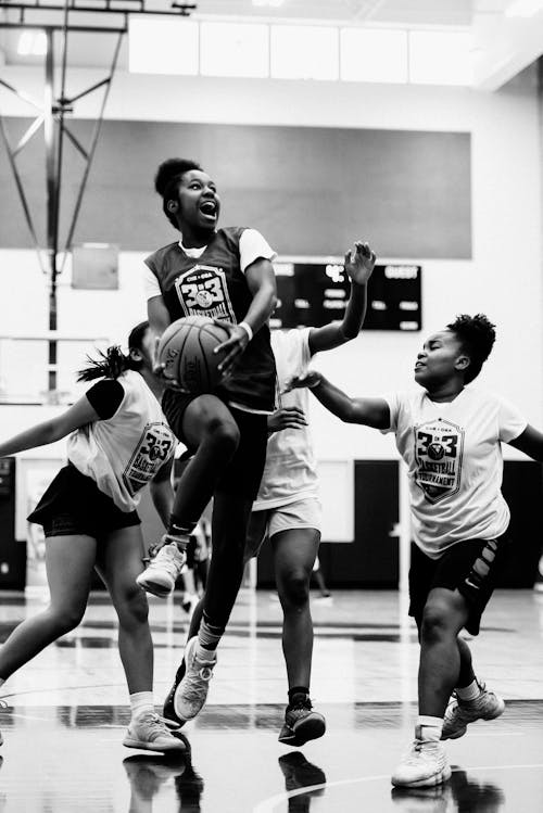 Woman Jumping With Ball