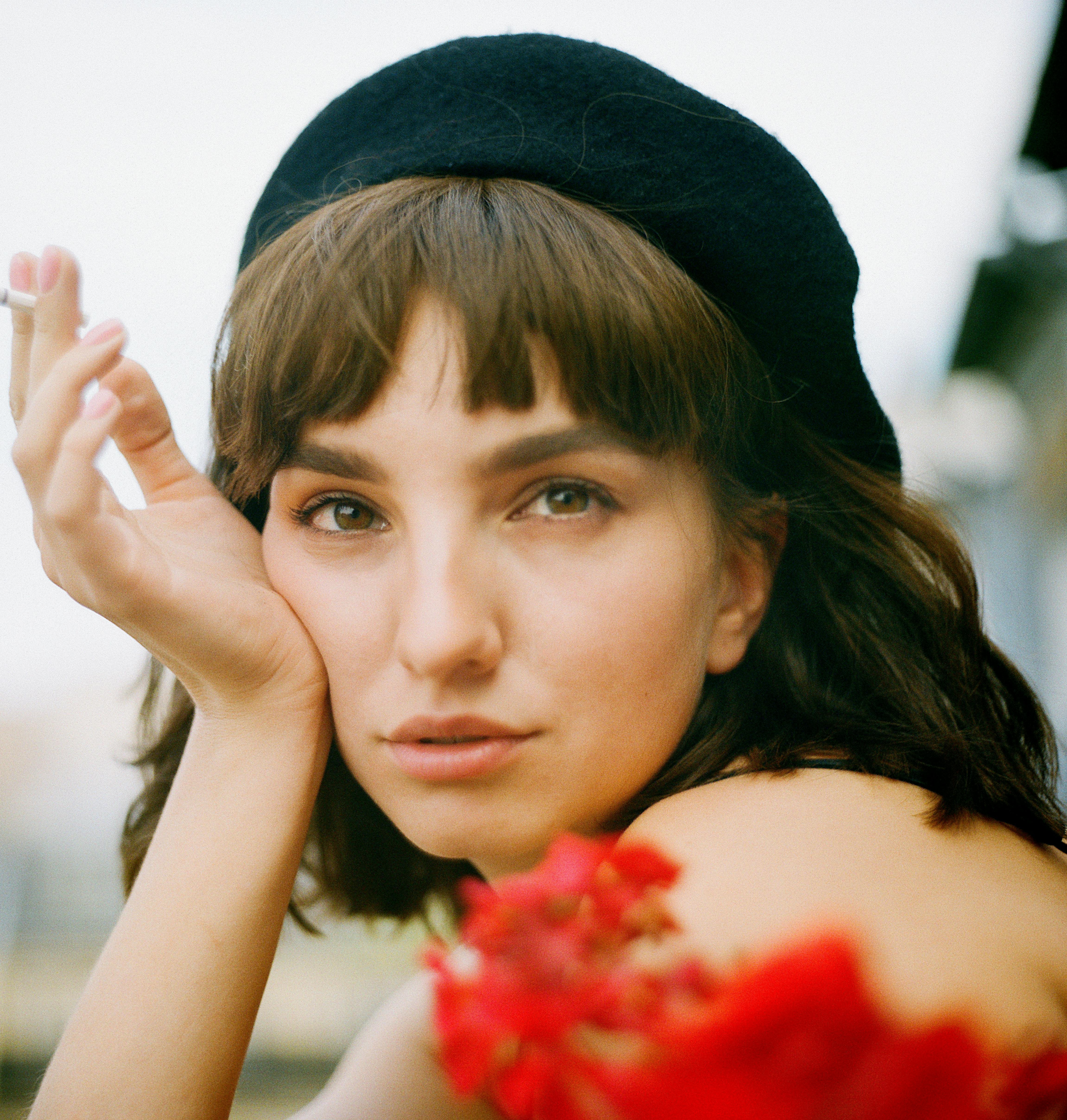 woman wearing black cap