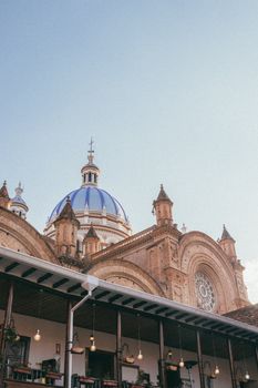 Beautiful view of the Basilica Cathedral of Cuenca featuring iconic blue domes against the sky.