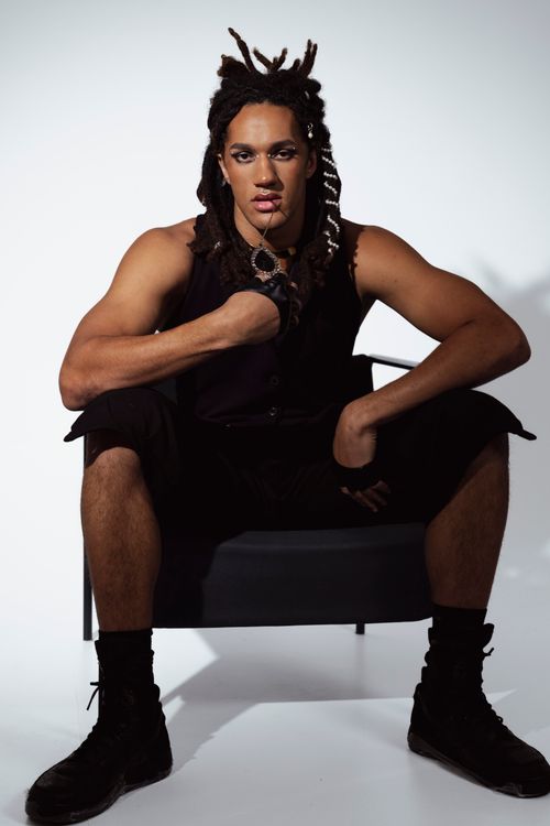 Free Striking portrait of a man in black attire exuding confidence and elegance. Stock Photo