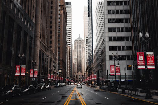 Dramatic cityscape of a bustling downtown with towering skyscrapers and lively streets.
