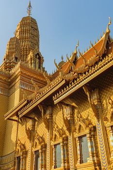Stunning golden temple facade in Bangkok, capturing intricate Thai architectural design.