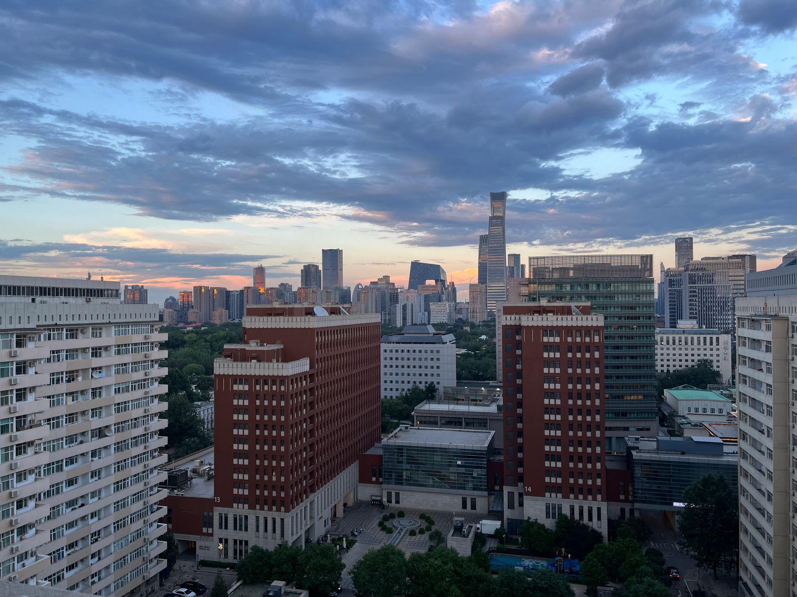 Beijing CBD skyline at dusk with China Zun and CCTV Headquarters, looking toward global markets