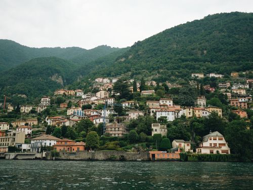 Free Charming hillside village along Lake Como surrounded by lush greenery. Stock Photo