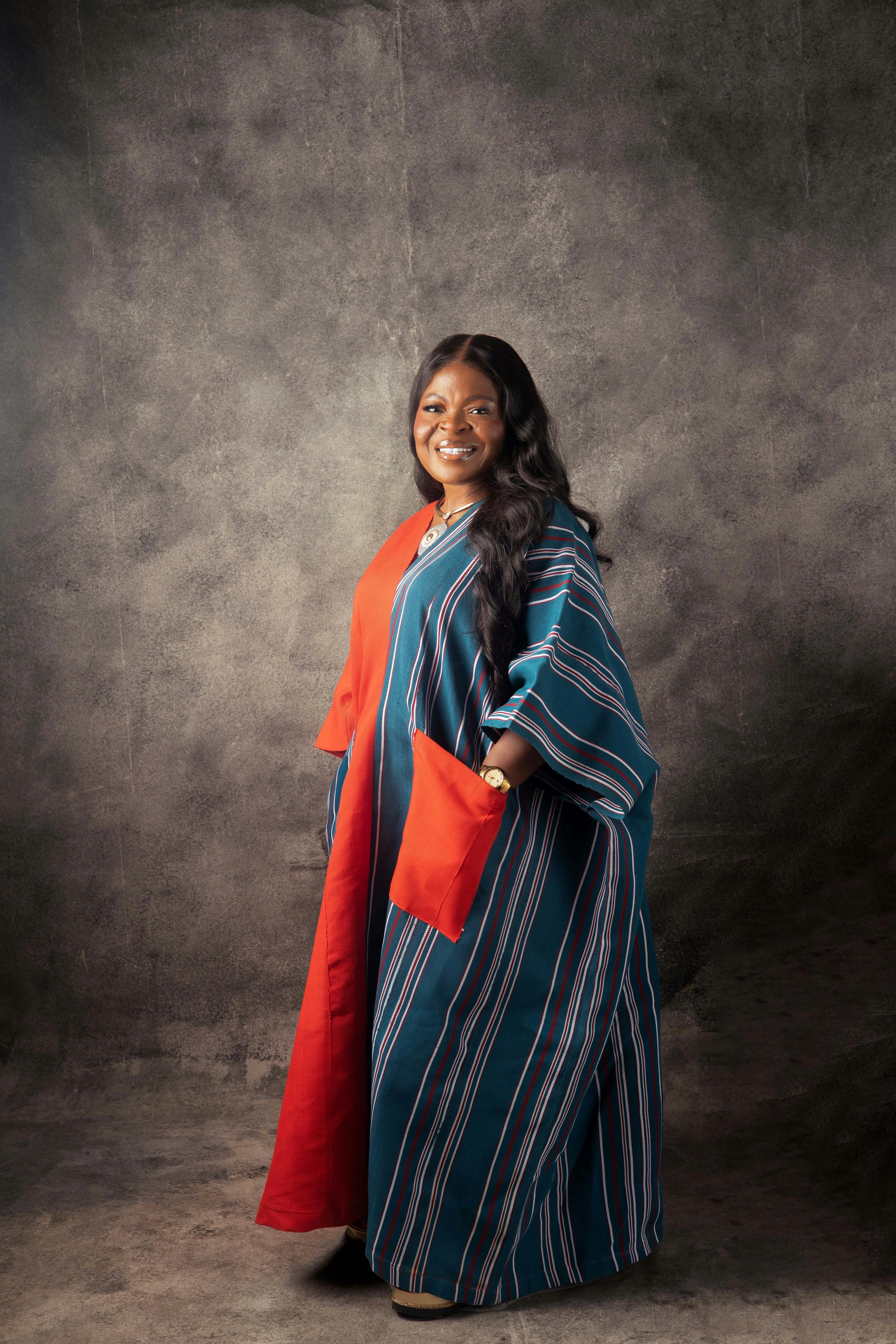 a woman in a long blue and red robe