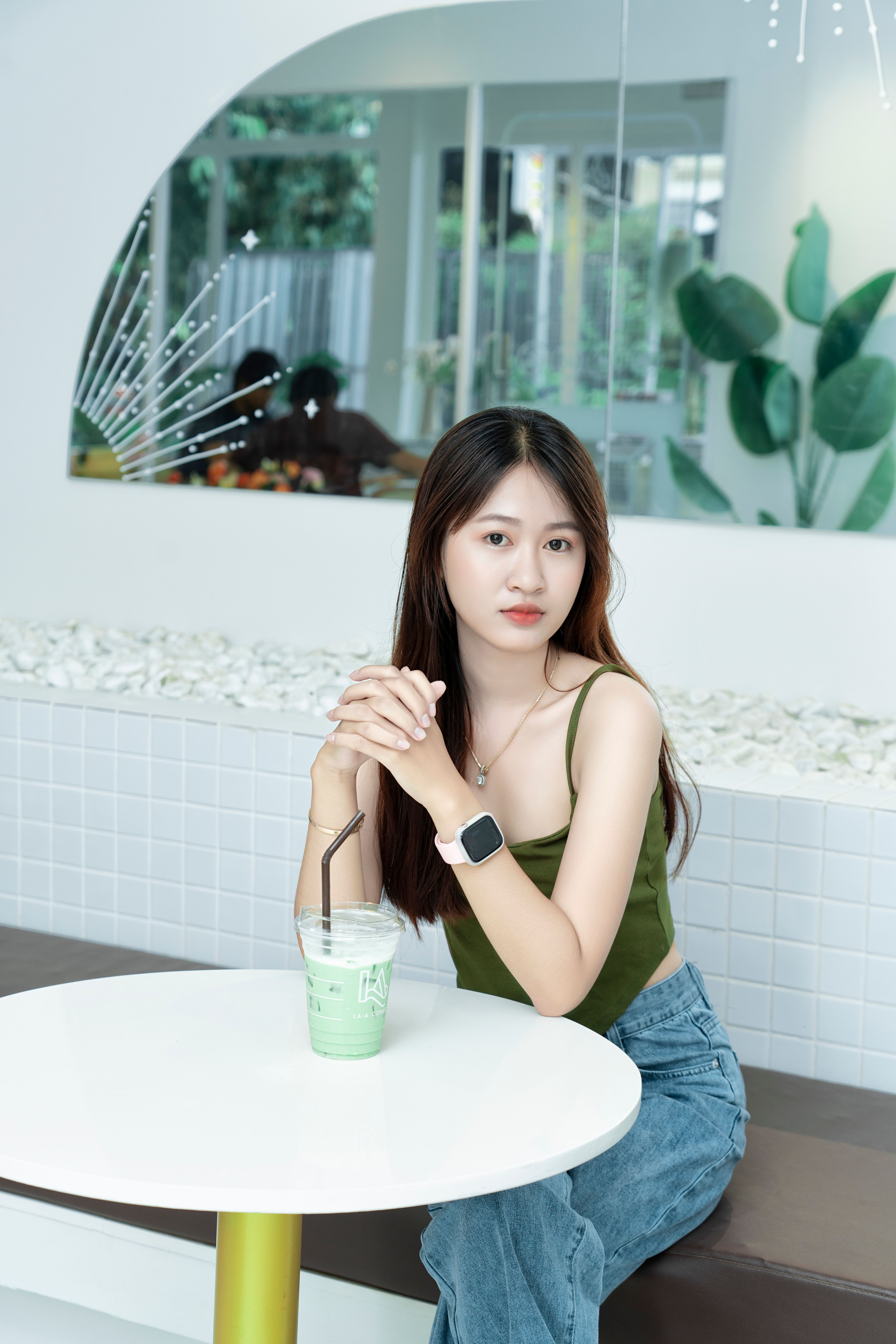 Woman Sitting at Cafe