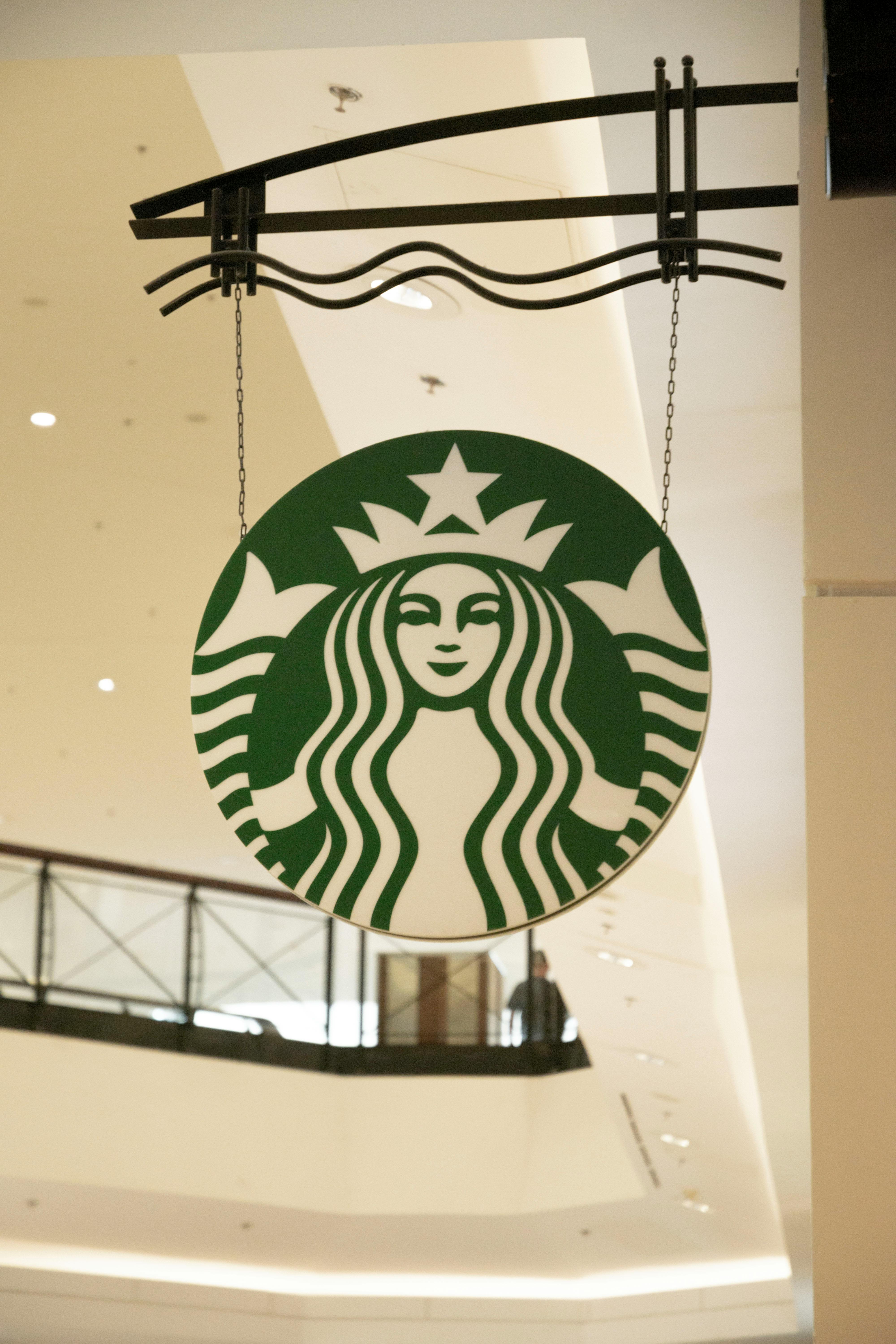 Close-up Photo of a Hanging Starbucks Signage · Free Stock Photo