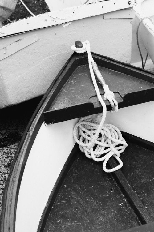 Free A black and white photo featuring boats with ropes, highlighting nautical elements and textures. Stock Photo