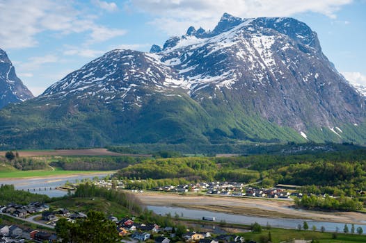 Breathtaking view of Åndalsnes with mountains, river, and settlement.