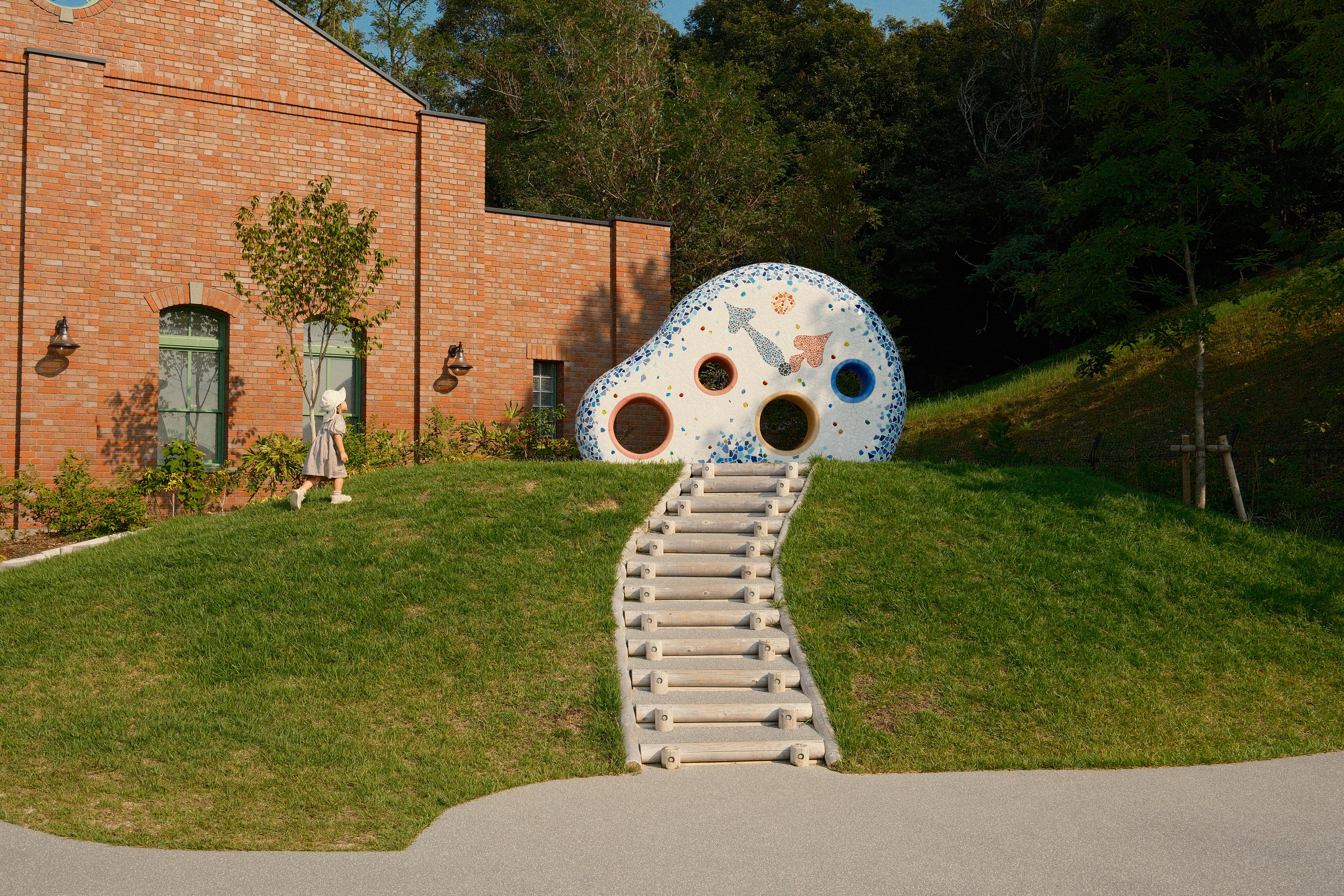 a large building with a large sculpture in front of it