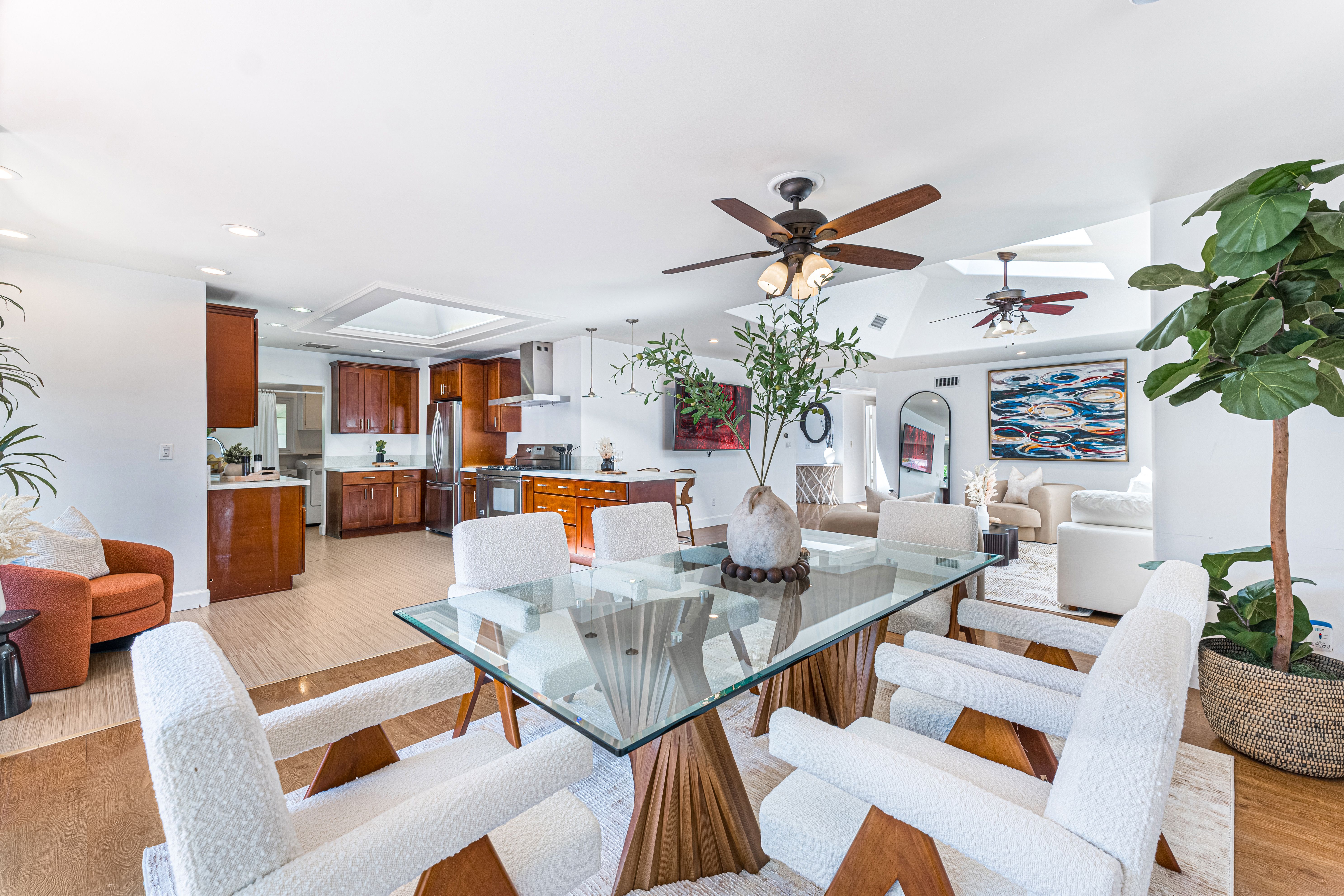 Bright staged open-concept living space with minimalist dining area