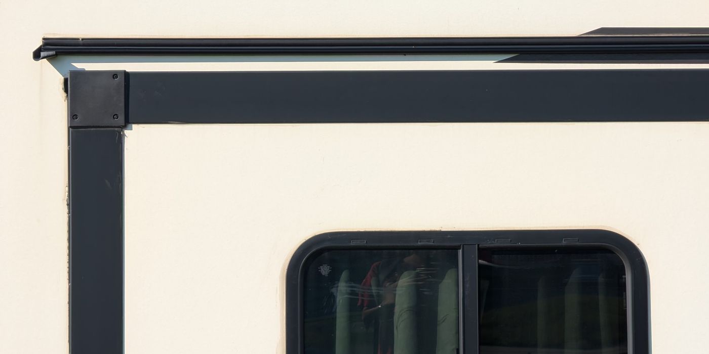 A rooftop air conditioner on top of a white RV