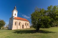 Stunning exterior view of a historic church surrounded by nature in Garešnica, Croatia.