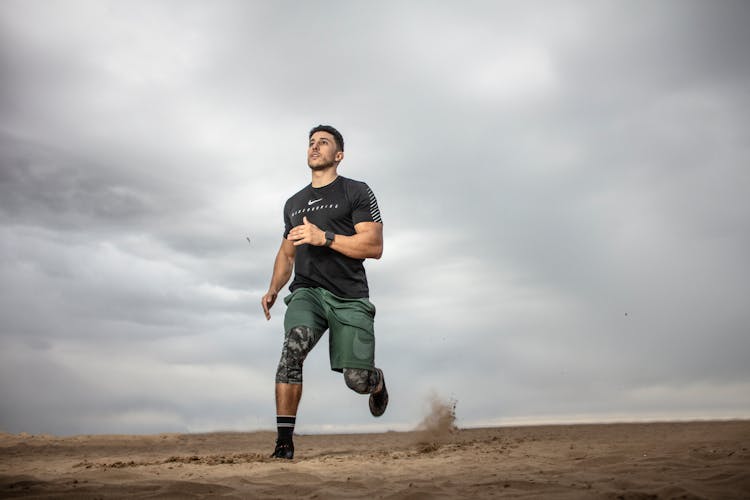 Man Running On Sand Field 