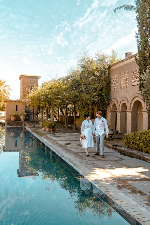 Couple Walking Near Pool