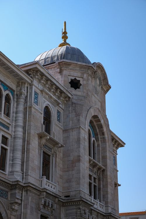 Free Elegant marble architecture with a classic dome under a clear blue sky. Stock Photo