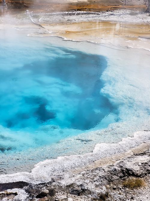Free Explore the vibrant turquoise waters of a geothermal hot spring in Yellowstone National Park. Stock Photo