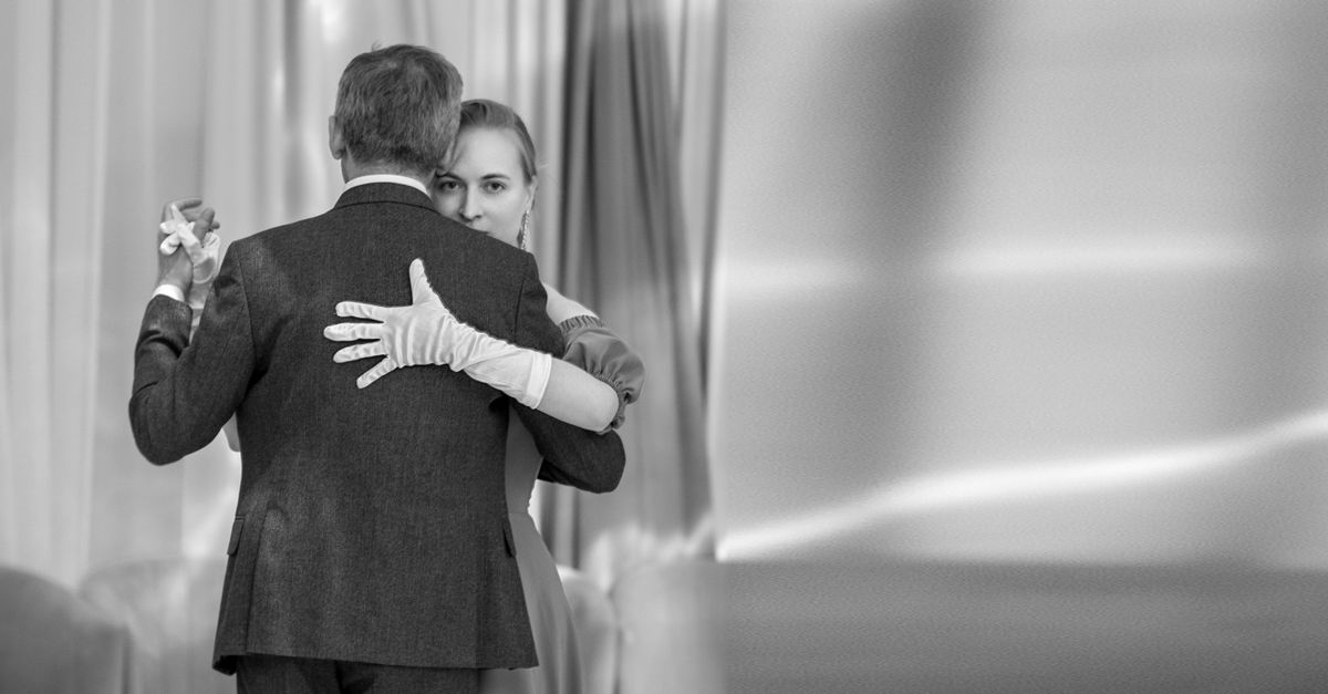 Couple in an abrazo during a milonga