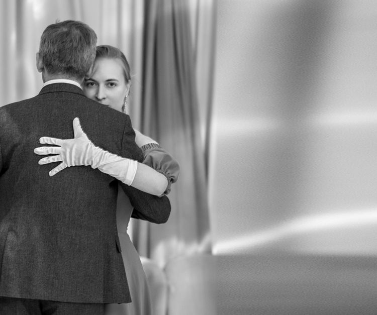 Couple in an abrazo during a milonga