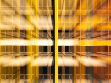 Vibrant abstract image of a modern building facade with geometric lines and blur effect.