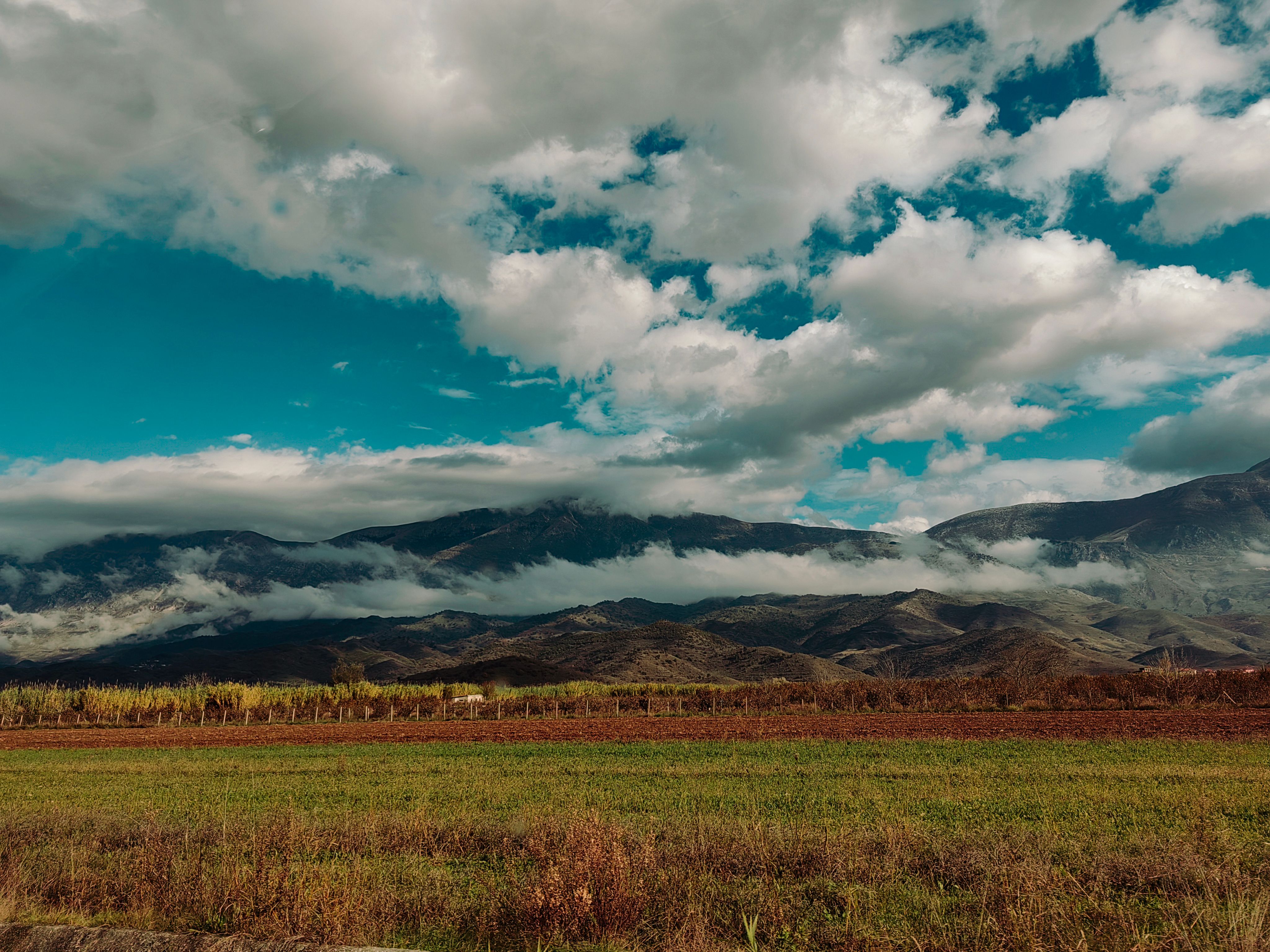 Gorgeous mountain landscape under a dramatic cloudy sky, ideal for travel and nature themes.