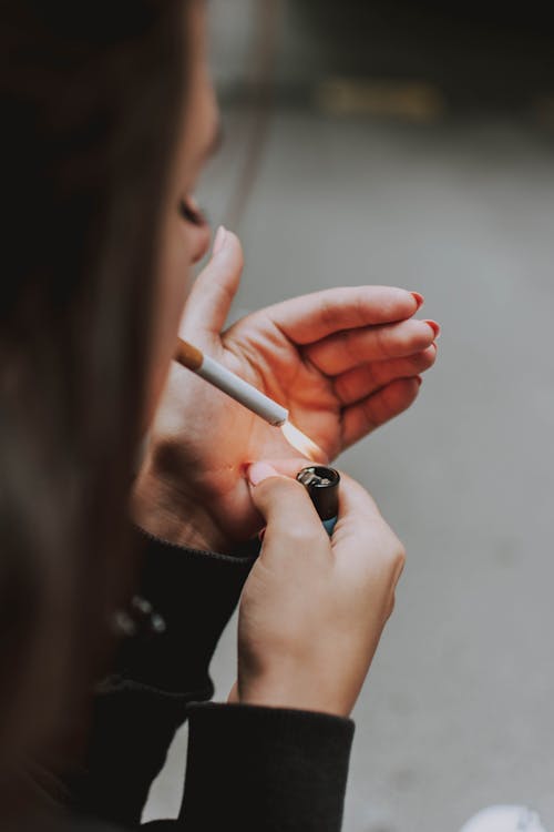 Free Person Lighting A Cigarette Stock Photo