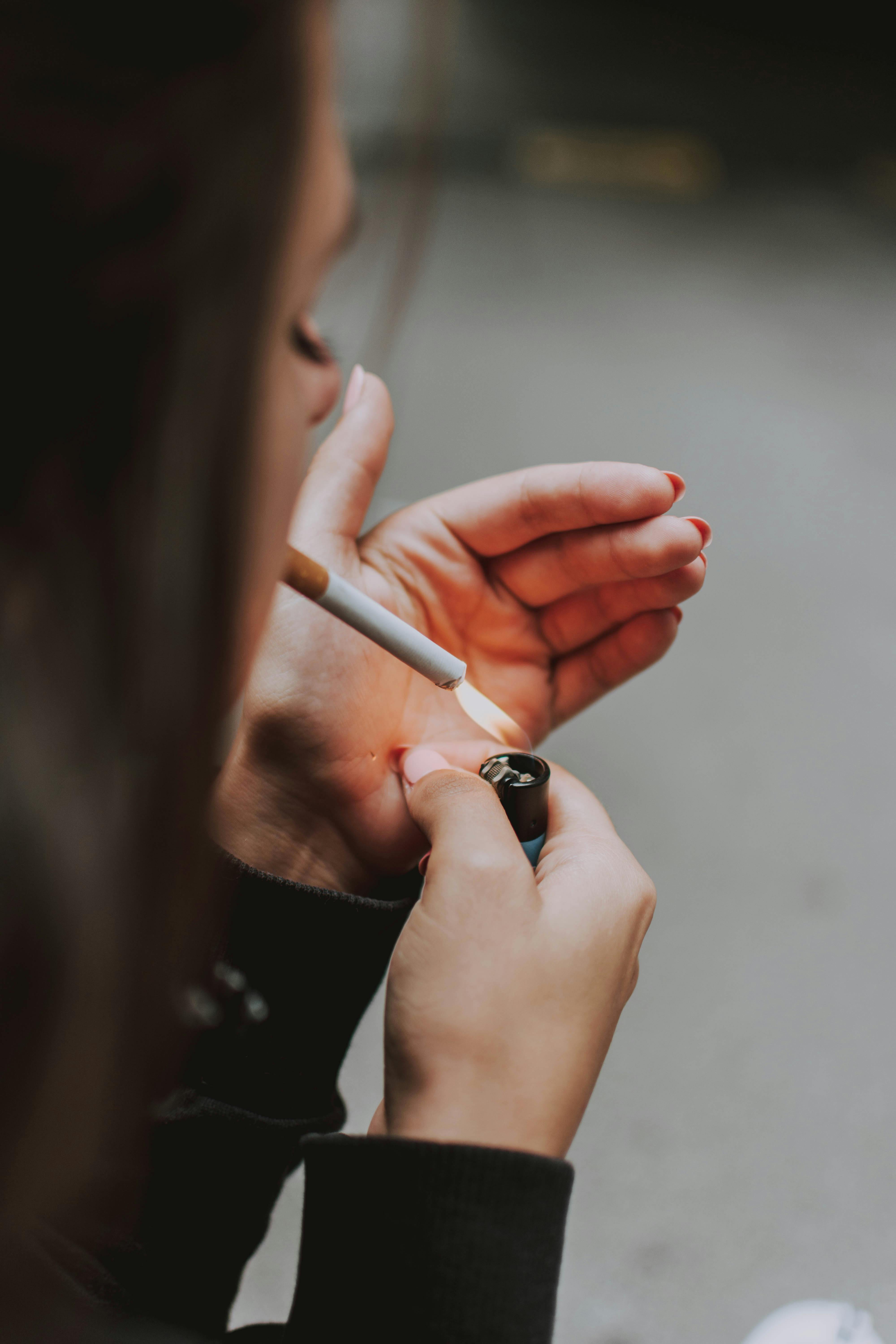 Person Lighting A Cigarette · Free Stock Photo