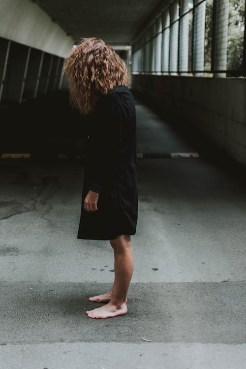 Woman In Black Long Sleeve Dress