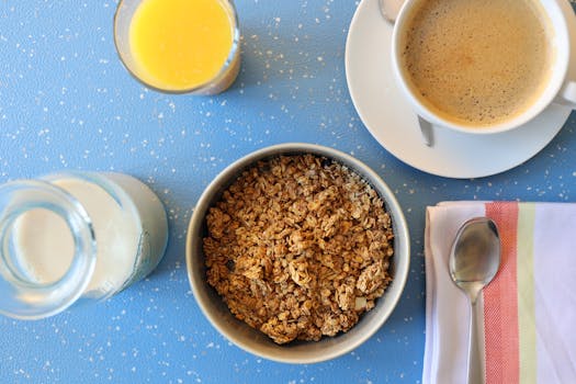 Delicious breakfast setup with coffee, granola, and juice for a nutritious start.