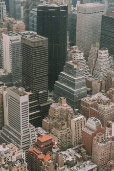Discover the dense urban landscape and iconic skyscrapers of New York City from above.