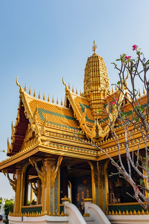 Free Stunning golden temple in Bangkok featuring intricate traditional Thai architectural design at sunset. Stock Photo