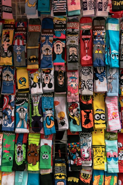 Free Colorful cartoon-themed socks on display at a street market in Mexico City, Mexico. Stock Photo