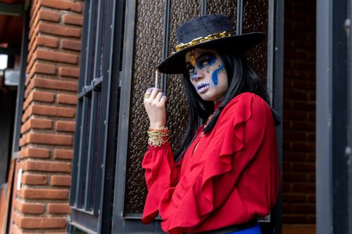Free Woman with Calavera makeup for Dia de Muertos in Mexico City. Stock Photo