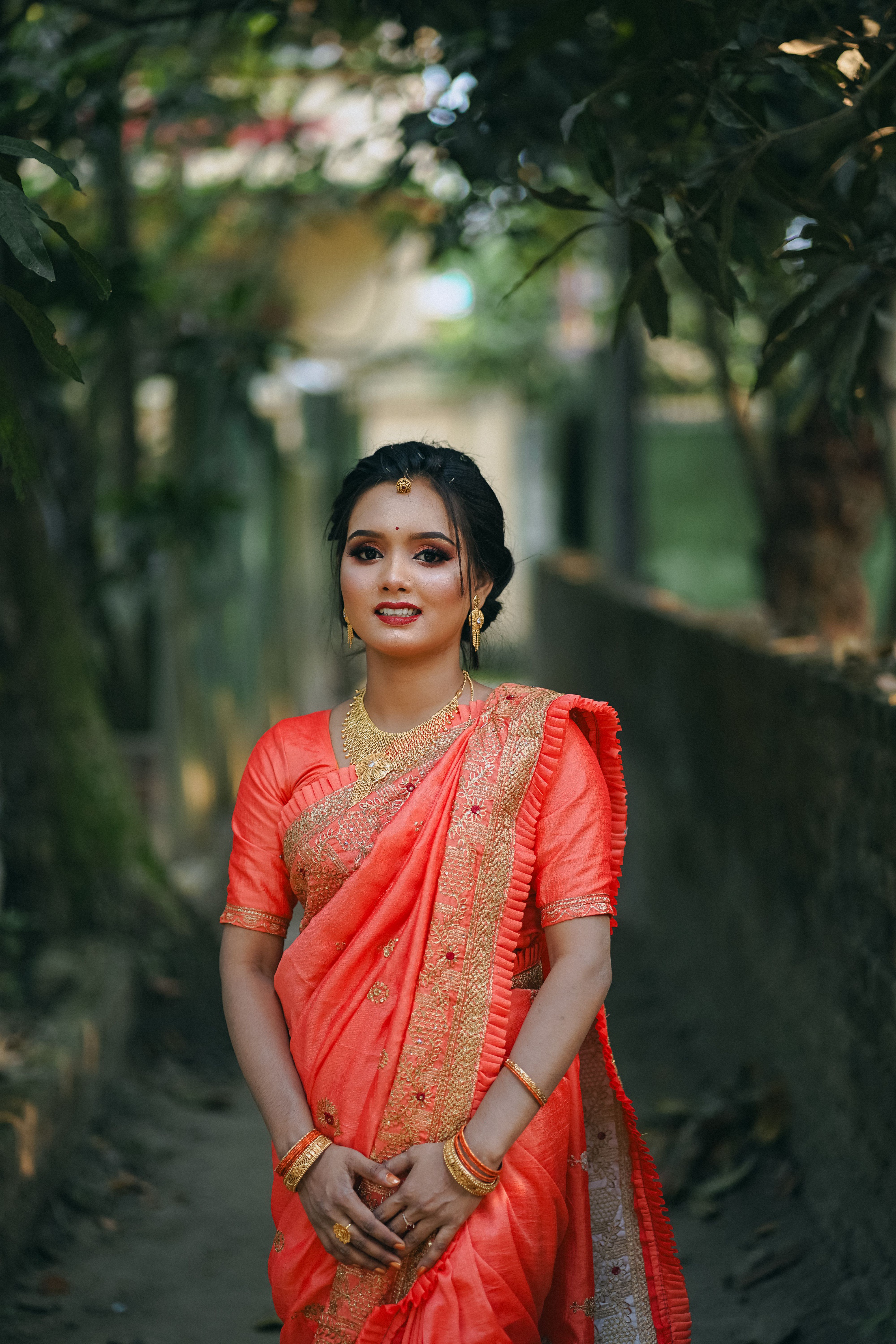 A beautiful young woman in an orange sari · Free Stock Photo