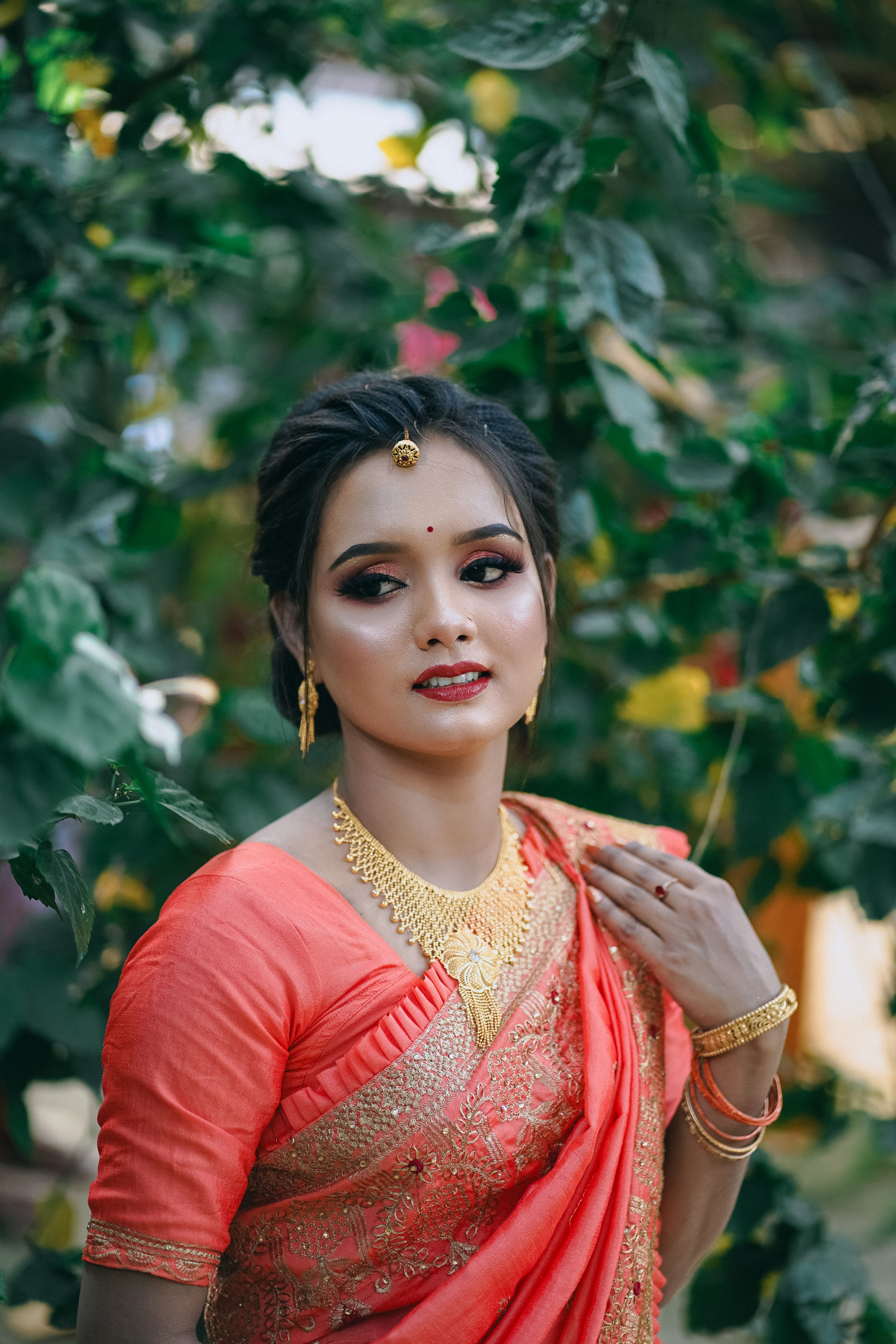 A beautiful woman in a sari posing for the camera · Free Stock Photo
