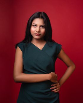 Stylish studio portrait of a young woman in Varanasi, showcasing elegance and confidence.