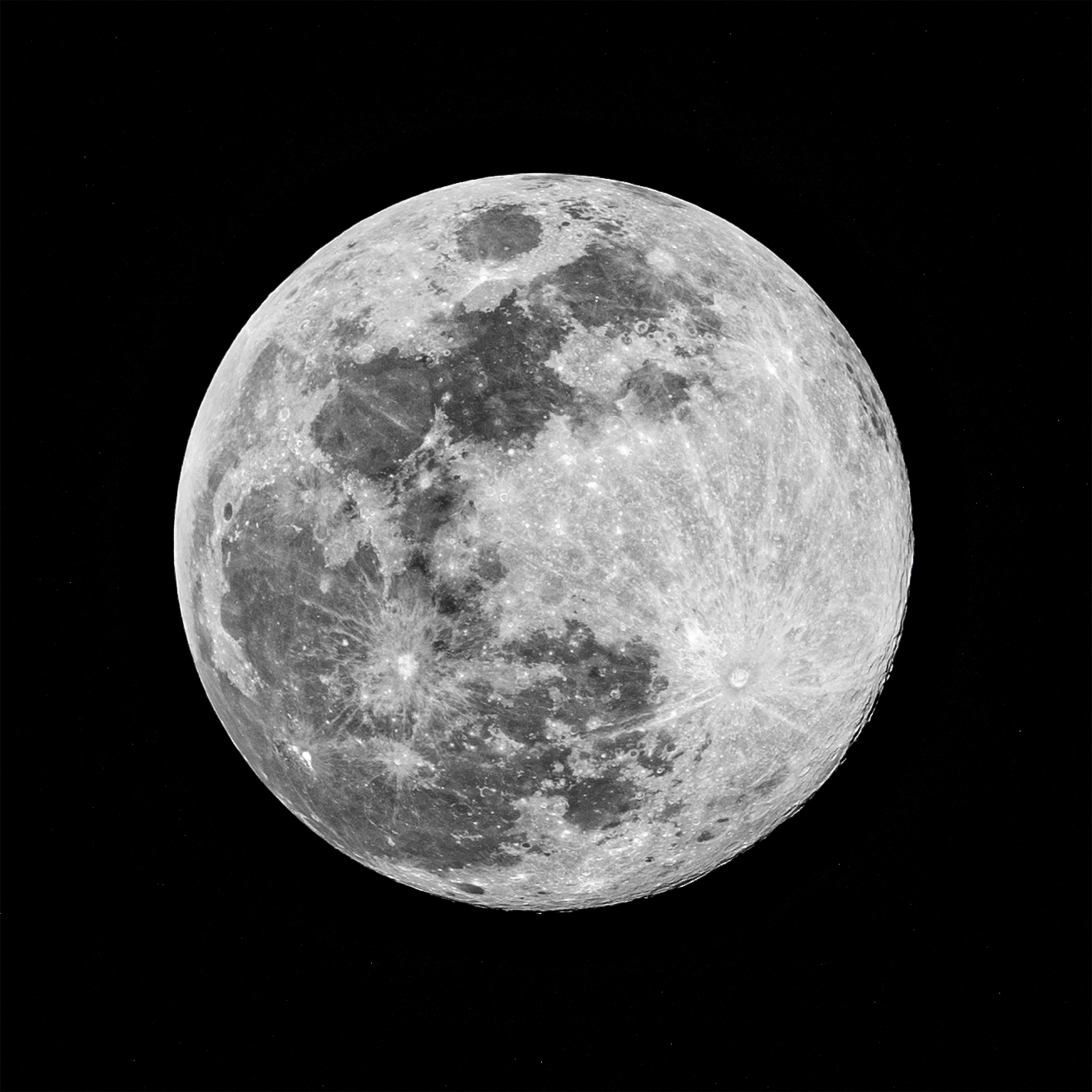 Black and white image of the full moon showcasing detailed craters, captured over Varanasi.